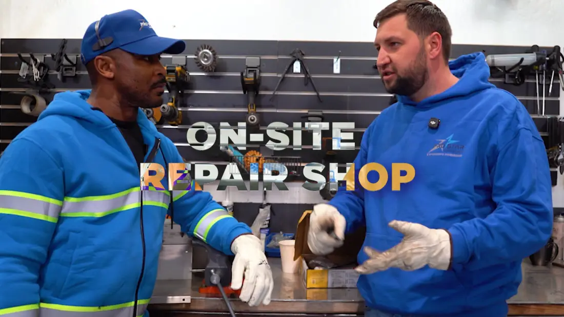 Mechanic and driver in the Pro Star repair shop